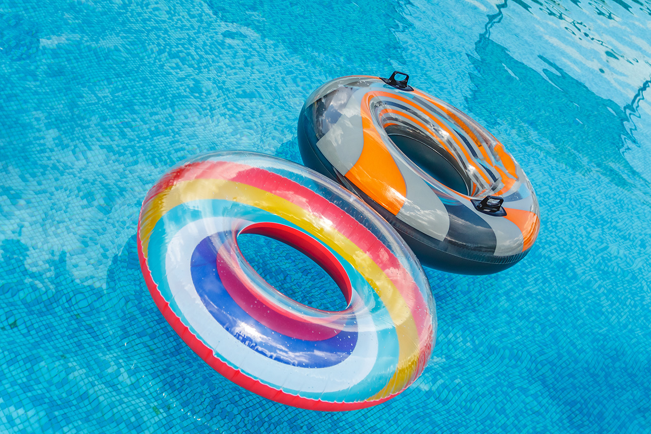inflatable water activities circles tuba float on the water in the pool concept fun perky summer and relaxation
